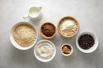 Chocolate oats brownies ingredients, cooking pastry, muffins, baking process, oat flour in bowls