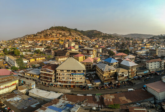 Freetown, Sierra Leone - 16 April 2022: Aerial view of people in the street at the city market in Freetown, Sierra Leone.