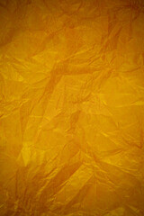 Crumpled gold paper recycling background.