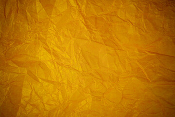 Crumpled gold paper recycling background.