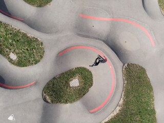 Aerial view of a person with a skateboard in a skate park, Pampigny, Switzerland.