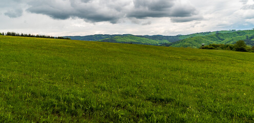 Fototapeta premium Springtime Bile Karpaty mountains with mix of meadows and forest covered hills