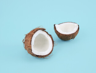 split coconut on blue background