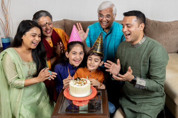 indian family celebrating birthday  at home 
