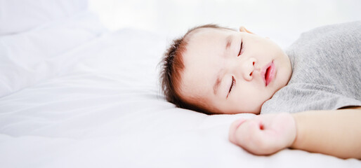 Fototapeta na wymiar Close-up portrait of a sleeping newborn baby