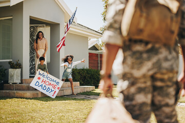 Excited young children welcoming their father from the army