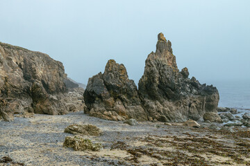 The Peninsula of Howth Head on a foggy day, the cliffs warped by fog, Dublin, Seashore of  cliffs, bays and rocks landscape, dangerouse cliffs, spectacular views in Ireland , Ireland