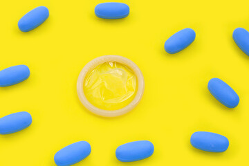Condom with PrEP ( Pre-Exposure Prophylaxis) used to prevent HIV. Safe sex concept.