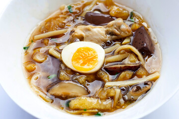 Fish maw soup on white background.