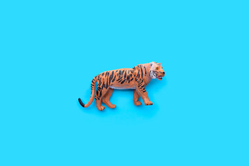Tiger toys on blue background.