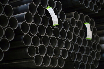 high quality steel pipe or Aluminum and chrome stainless pipes in stack waiting for shipment in warehouse