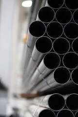 high quality steel pipe or Aluminum and chrome stainless pipes in stack waiting for shipment in warehouse