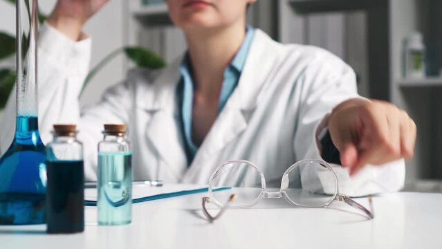 Woman doctor, laboratory assistant researcher tired after hard day. Hospital worker in laboratory room. Modern medical virology. Investigation of new virus monkeypox. Сaucasian doctor take off glasses