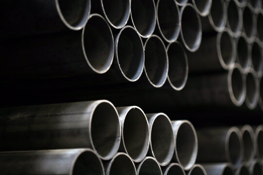 high quality steel pipe or Aluminum and chrome stainless pipes in stack waiting for shipment in warehouse
