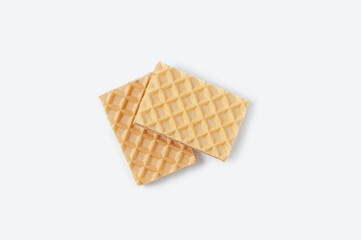 Two crispy a waffles. Sweet pastry. White background.