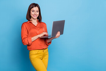 Photo of young woman use laptop project workshop representative expert isolated over blue color...