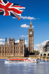 Famous Big Ben with bridge over Thames and tour boat on the river in London, England, UK - 509995081