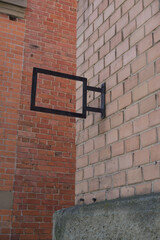 brick wall and empty sign frame
