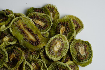 Close up of Natural Dried Kiwi Slices Snack. Dried Kiwi for baking.  Isolated white background.