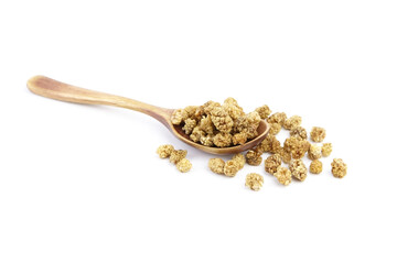 Mulberry dry berries morus alba in wooden spoon isolated on white