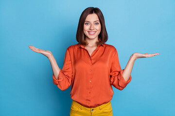 Photo of young pretty lady promoter hold hands solutions scales compare measure advertise isolated...