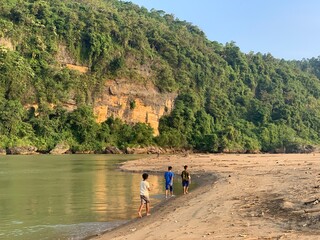 Group of kids walking on the riverside