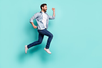 Fototapeta na wymiar Full length photo of energetic crazy person rush look empty space jumping isolated on turquoise color background