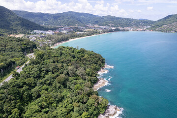Fototapeta na wymiar Aerial view of curve road along the seashore at Phuket Thailand beautiful seacoast and open sea in summer season Nature recovered Environment and Travel background