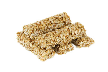 Brittle sticks from seeds in sugar glaze cut out on a white background. Arabic sunflower dessert.