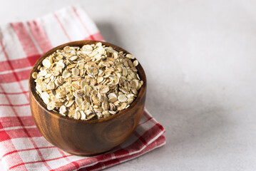 Wooden Bowl of Cereal Oat Flakes Healthy Food Linen Napkin Copy Space
