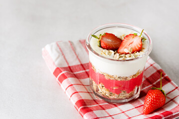 Healthy Breakfast Concept Oat Flakes or Granola with Yogurt and Strawberry Diet Food Gray Background Copy Space