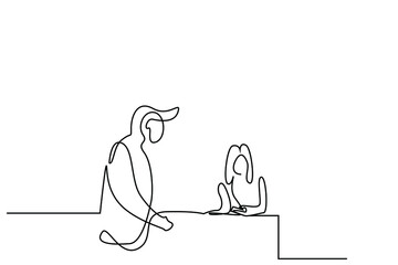 a man is standing at the hotel reception where he is on vacation and a female employee is checking in