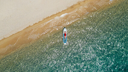 Woman enjoys relaxation on a paddle board