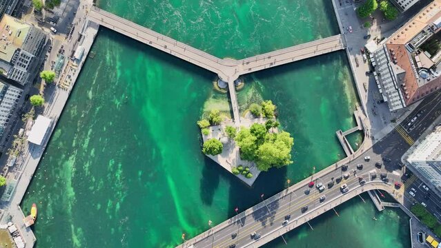 aerial view in Geneva city centre, clear water river in downtown Geneva in Switzerland, top down view of river Rhone in Geneva