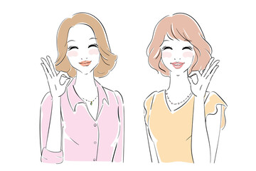 OKサインを出すきれいな女性　二人