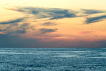 Naklejka na ściany i meble Sunset over the calm ocean