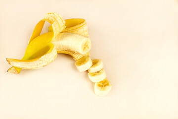 Open sliced ​​banana on a light background