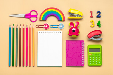 Frame from school and office supplies Paper clips, pens, calculator, sharpener, notepad, stapler isolated on beige background Flat lay Top view Back to school, education concept Mock up Copy space - 510010048
