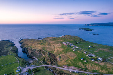 Sunset over Geodha Smoo and Smoo Cave Cliffs from a drone, NC500, North Scotland, UK
