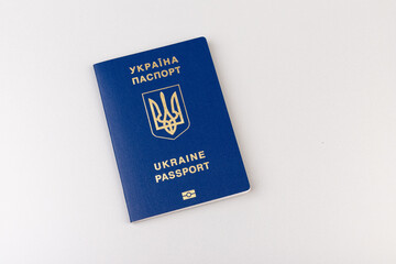 Ukrainian passport with a golden trident symbol on light background. Biometric Ukraine passport id empty place for photo or text.