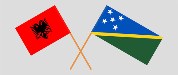 Crossed flags of Albania and Solomon Islands. Official colors. Correct proportion