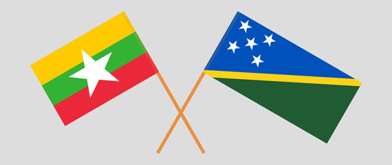 Crossed flags of Myanmar and Solomon Islands. Official colors. Correct proportion