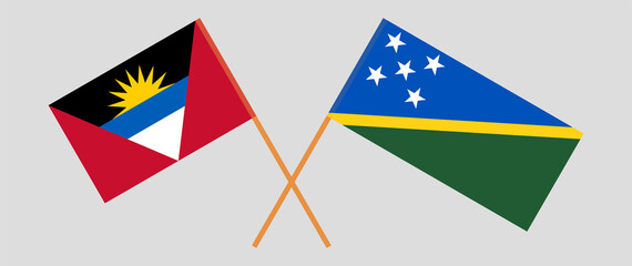 Crossed flags of Antigua and Barbuda and Solomon Islands. Official colors. Correct proportion