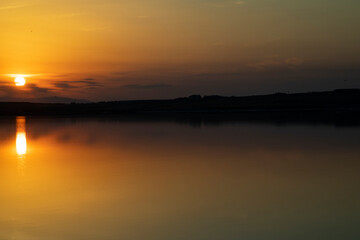 Fototapeta na wymiar Summer beautiful sunset on the lake of Azerbaijan