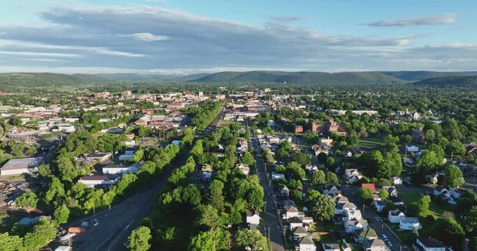 Late afternoon spring, summer aerial video of area around Elmira New York