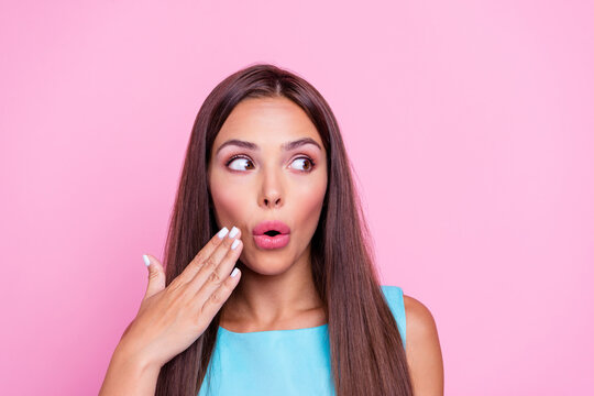 Photo of shocked impressed woman wear turquoise dress arm cheek looking empty space isolated pink color background