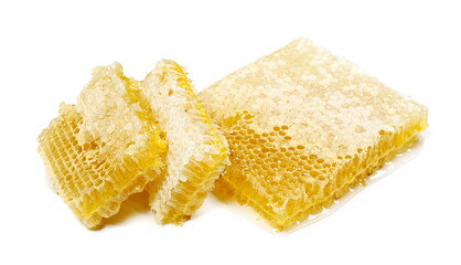 Yellow honeycomb with acacia honey isolated on white