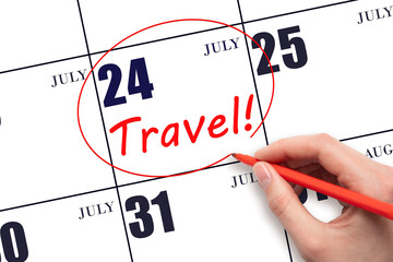 Hand drawing a red circle and writing the text TRAVEL on the calendar date 24July. Travel planning.
