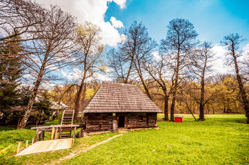 Plakat Wind mills from Astra old hause Museum Sibiu. Traditional rustic houses in Astra complex. Discover Romania. Old traditional farm., rustic house and dependencies