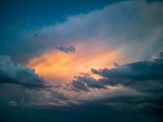Orange light among the dark storm clouds